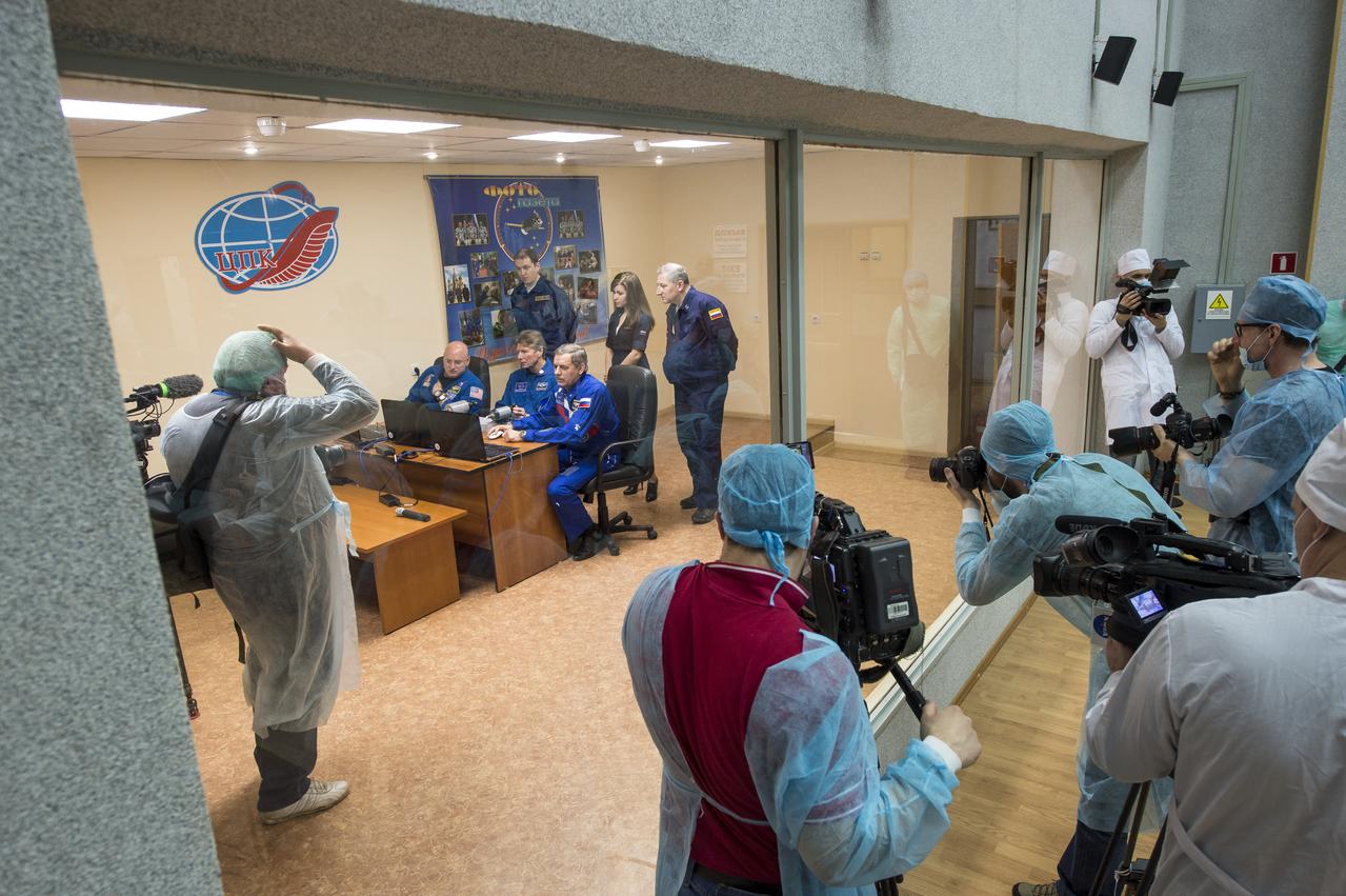 Media document Expedition 43 NASA Astronaut Scott Kelly, seated left, Russian Cosmonauts Gennady Padalka, center, and Mikhail Kornienko of the Russian Federal Space Agency (Roscosmos) as they work on Soyuz training, Saturday, March 21, 2015 at the Cosmonaut Hotel in Baikonur, Kazakhstan. Kelly, Padalka, and Kornienko are preparing for launch to the International Space Station in their Soyuz TMA-16M spacecraft from the Baikonur Cosmodrome in Kazakhstan March 28, Kazakh time (March 27 Eastern time.) As the one-year crew, Kelly and Kornienko will return to Earth on Soyuz TMA-18M in March 2016. Photo Credit: (NASA/Bill Ingalls)