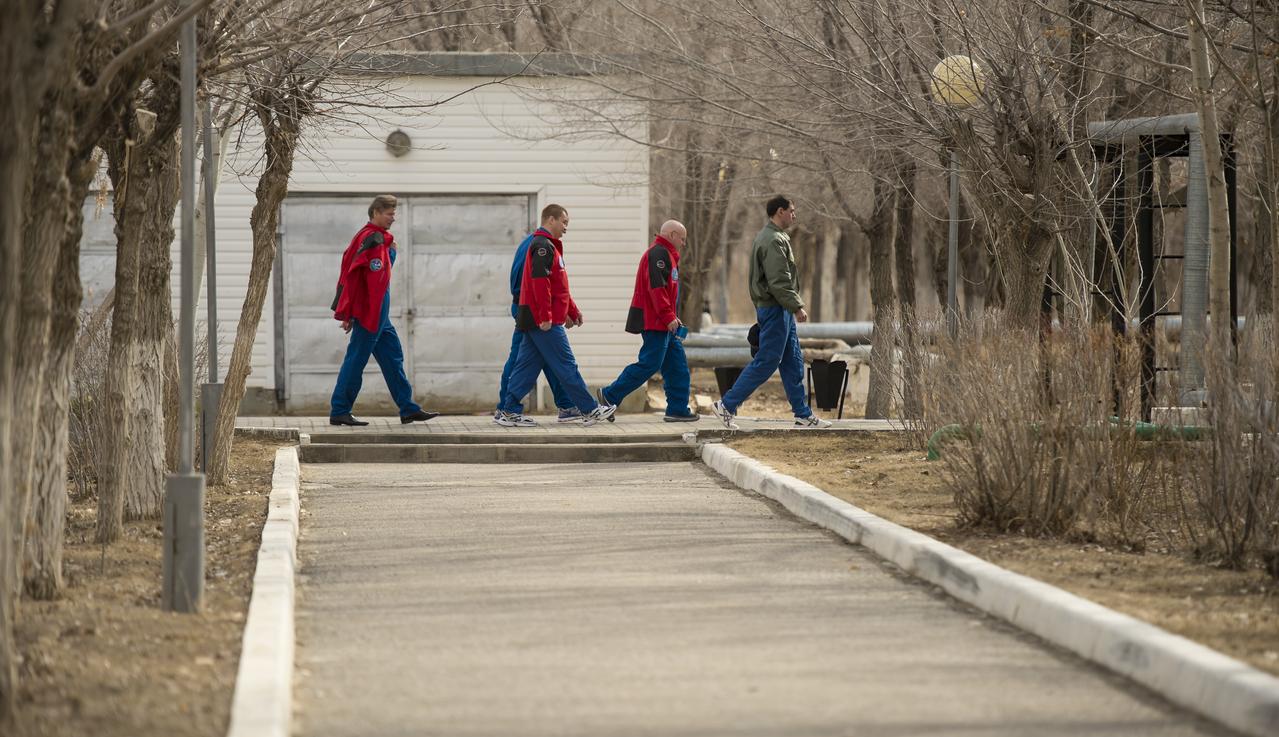 Expedition 43 prime and backup crews walk from the Cosmonaut Hotel over to the Zvjozdnyj Hotel for a short break during media day, Saturday, March 21, 2015, Baikonur, Kazakhstan. Expedition 43 NASA Astronaut Scott Kelly, and Russian Cosmonauts Gennady Padalka, and Mikhail Kornienko of the Russian Federal Space Agency (Roscosmos) are scheduled to launch to the International Space Station in the Soyuz TMA-16M spacecraft from the Baikonur Cosmodrome in Kazakhstan March 28, Kazakh time (March 27 Eastern time.) As the one-year crew, Kelly and Kornienko will return to Earth on Soyuz TMA-18M in March 2016. Photo Credit: (NASA/Bill Ingalls)