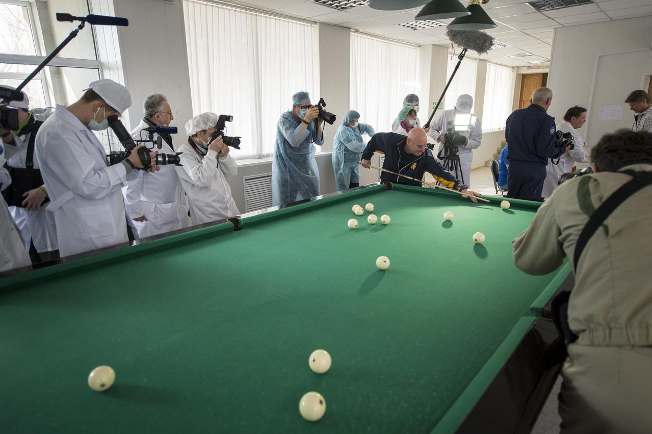 Media document Expedition 43 NASA Astronaut Scott Kelly as he plays billiards during media day, Saturday, March 21, 2015, Baikonur, Kazakhstan. Kelly, and Russian Cosmonauts Gennady Padalka, and Mikhail Kornienko of the Russian Federal Space Agency (Roscosmos) are scheduled to launch to the International Space Station in the Soyuz TMA-16M spacecraft from the Baikonur Cosmodrome in Kazakhstan March 28, Kazakh time (March 27 Eastern time.) As the one-year crew, Kelly and Kornienko will return to Earth on Soyuz TMA-18M in March 2016. Photo Credit: (NASA/Bill Ingalls)
