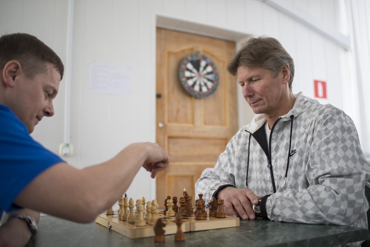 Gagarin Cosmonaut Training Center (GCTC) Flight Surgeon Alexey Grishin, left, and Russian Cosmonaut Gennady Padalka of the Russian Federal Space Agency (Roscosmos) play a game of chess during media day, Saturday, March 21, 2015, Baikonur, Kazakhstan. Padalka, fellow Russian Cosmonaut Mikhail Kornienko of Roscosmos, and NASA Astronaut Scott Kelly are scheduled to launch to the International Space Station in the Soyuz TMA-16M spacecraft from the Baikonur Cosmodrome in Kazakhstan March 28, Kazakh time (March 27 Eastern time.) As the one-year crew, Kelly and Kornienko will return to Earth on Soyuz TMA-18M in March 2016. Photo Credit: (NASA/Bill Ingalls)