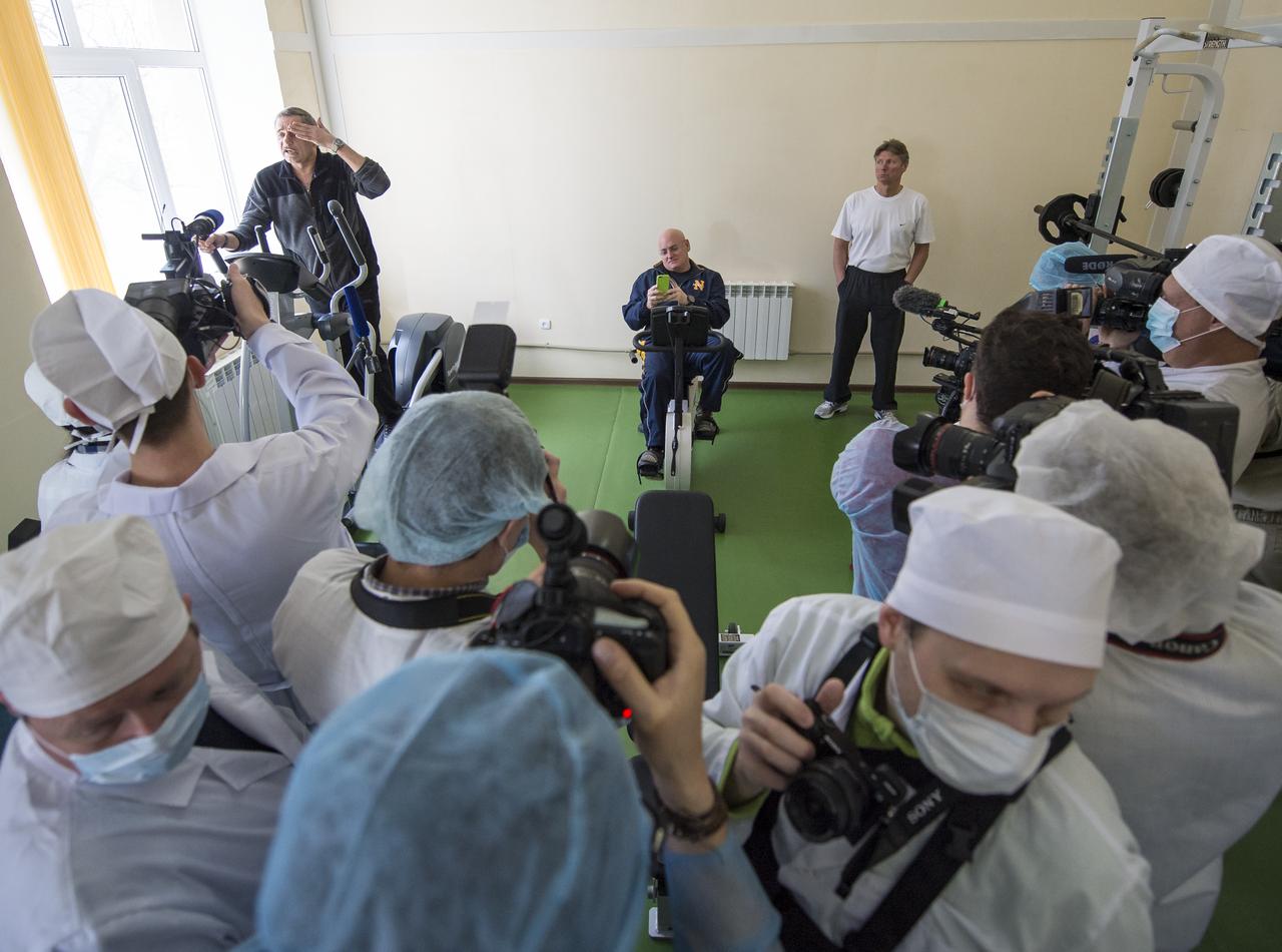 Expedition 43 Russian Cosmonaut Mikhail Kornienko of the Russian Federal Space Agency (Roscosmos), left, NASA Astronaut Scott Kelly, center, and Russian Cosmonaut Gennady Padalka are seen during media day, Saturday, March 21, 2015, Baikonur, Kazakhstan. Kelly, Padalka, and Kornienko are scheduled to launch to the International Space Station in the Soyuz TMA-16M spacecraft from the Baikonur Cosmodrome in Kazakhstan March 28, Kazakh time (March 27 Eastern time.) As the one-year crew, Kelly and Kornienko will return to Earth on Soyuz TMA-18M in March 2016. Photo Credit: (NASA/Bill Ingalls)