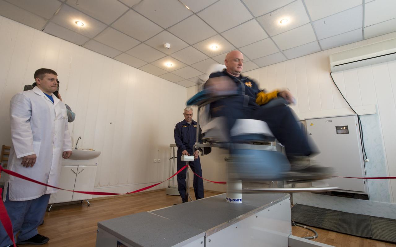 Expedition 43 NASA Astronaut Scott Kelly takes part in the spin chair training during media day, Saturday, March 21, 2015, Baikonur, Kazakhstan. Kelly, and Russian Cosmonauts Gennady Padalka, and Mikhail Kornienko of the Russian Federal Space Agency (Roscosmos) are scheduled to launch to the International Space Station in the Soyuz TMA-16M spacecraft from the Baikonur Cosmodrome in Kazakhstan March 28, Kazakh time (March 27 Eastern time.) As the one-year crew, Kelly and Kornienko will return to Earth on Soyuz TMA-18M in March 2016. Photo Credit: (NASA/Bill Ingalls)