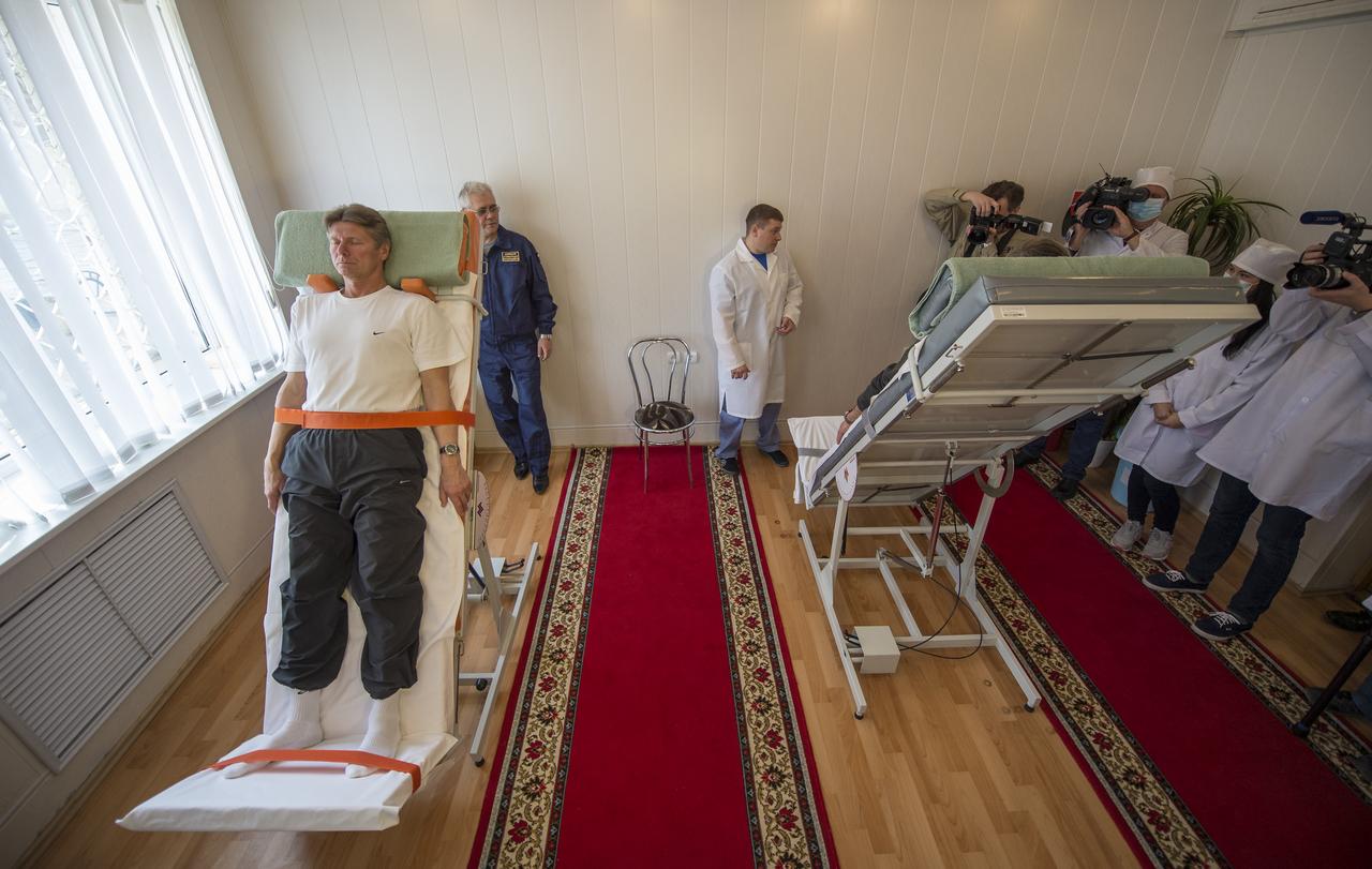 Expedition 43 Russian Cosmonauts Gennady Padalka, left, and Mikhail Kornienko of the Russian Federal Space Agency (Roscosmos) take part the tilt table training during media day, Saturday, March 21, 2015, Baikonur, Kazakhstan. Padalka, Kornienko, and Expedition 43 NASA Astronaut Scott Kelly are scheduled to launch to the International Space Station in the Soyuz TMA-16M spacecraft from the Baikonur Cosmodrome in Kazakhstan March 28, Kazakh time (March 27 Eastern time.) As the one-year crew, Kelly and Kornienko will return to Earth on Soyuz TMA-18M in March 2016. Photo Credit: (NASA/Bill Ingalls)
