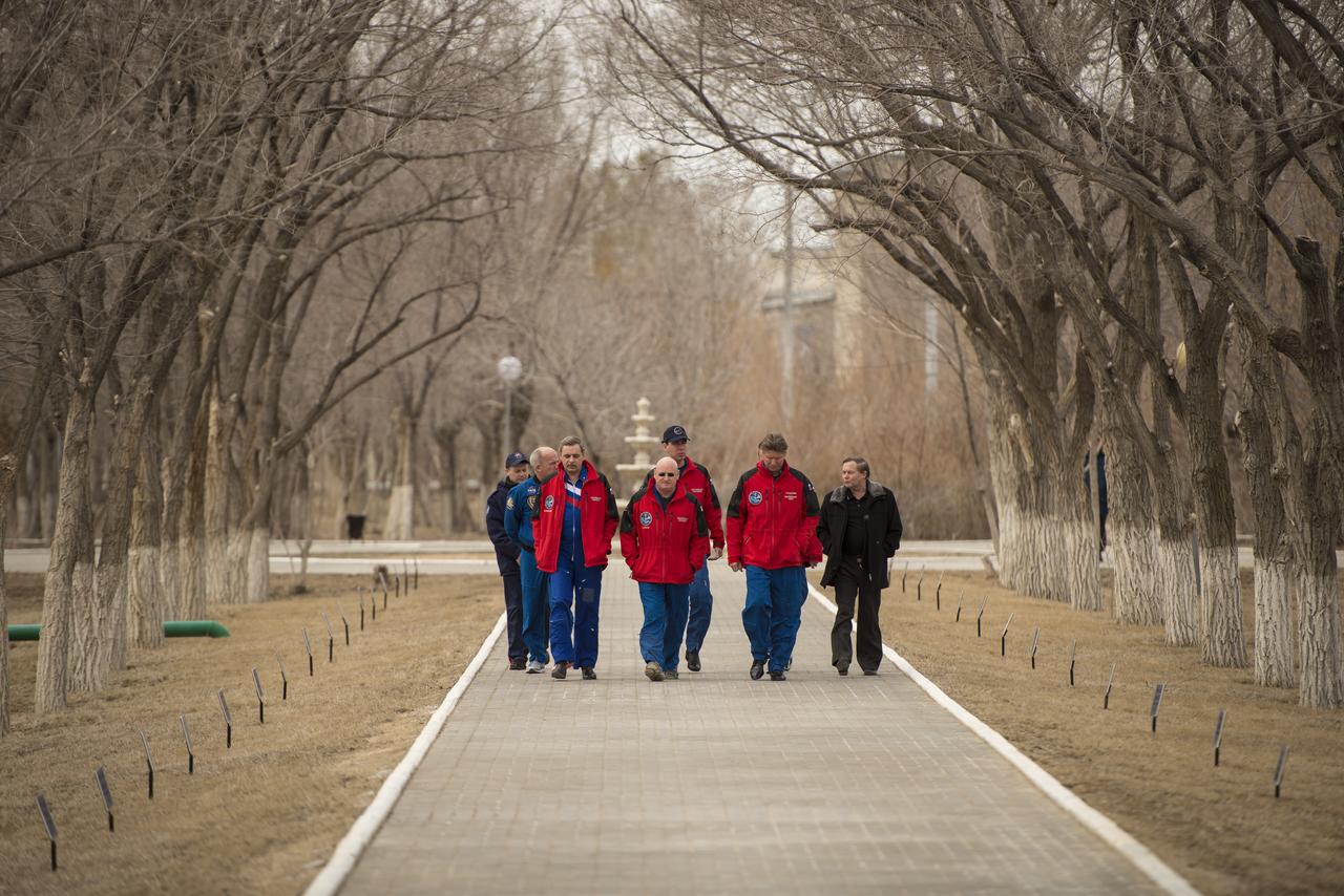 Expedition 43 prime crew members: NASA Astronaut Scott Kelly, and Russian Cosmonauts Gennady Padalka, and Mikhail Kornienko of the Russian Federal Space Agency (Roscosmos), and backup crew members Sergei Volkov, and Alexey Ovchinin and of Roscosmos, and NASA Astronaut Jeff Williams walk along the Avenue of the Cosmonauts where two long rows of trees are all marked with the name and year of the crew member who planted them starting from Yuri Gagarin's tree, Saturday, March 21, 2015, Baikonur, Kazakhstan. Expedition 43 NASA Astronaut Scott Kelly, and Russian Cosmonauts Gennady Padalka, and Mikhail Kornienko of the Russian Federal Space Agency (Roscosmos) are scheduled to launch to the International Space Station in the Soyuz TMA-16M spacecraft from the Baikonur Cosmodrome in Kazakhstan March 28, Kazakh time (March 27 Eastern time.) As the one-year crew, Kelly and Kornienko will return to Earth on Soyuz TMA-18M in March 2016. Photo Credit: (NASA/Bill Ingalls)