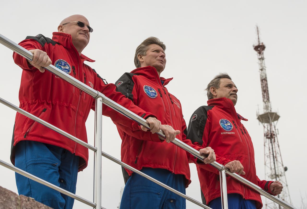Expedition 43 NASA Astronaut Scott Kelly, left, Russian Cosmonauts Gennady Padalka, center, and Mikhail Kornienko of the Russian Federal Space Agency (Roscosmos) take in the view from a overlook during media day, Saturday, March 21, 2015 at the Cosmonaut Hotel in Baikonur, Kazakhstan. Kelly, Padalka, and Kornienko are preparing for launch to the International Space Station in their Soyuz TMA-16M spacecraft from the Baikonur Cosmodrome in Kazakhstan March 28, Kazakh time (March 27 Eastern time.) As the one-year crew, Kelly and Kornienko will return to Earth on Soyuz TMA-18M in March 2016. Photo Credit: (NASA/Bill Ingalls)