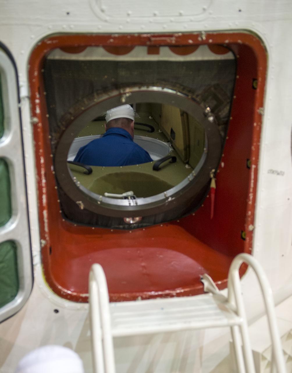 Expedition 43 backup crew member Alexey Ovchinin of the Russian Federal Space Agency (Roscosmos) is seen inside the Soyuz TMA-16M spacecraft during a final check, Monday, March 23, 2015 at the Baikonur Cosmodrome in Kazakhstan. NASA Astronaut Scott Kelly, and Russian Cosmonauts Mikhail Kornienko, and Gennady Padalka of the Russian Federal Space Agency (Roscosmos) are scheduled to launch to the International Space Station in the Soyuz TMA-16M spacecraft from the Baikonur Cosmodrome in Kazakhstan March 28, Kazakh time (March 27 Eastern time.) As the one-year crew, Kelly and Kornienko will return to Earth on Soyuz TMA-18M in March 2016. Photo Credit: (NASA/Bill Ingalls)