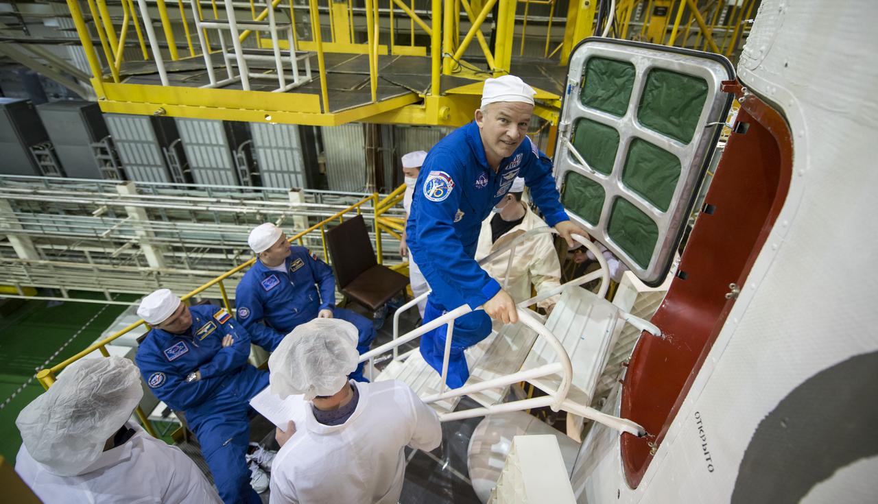 Expedition 43 backup crew member NASA Astronaut Jeff Williams enters the Soyuz TMA-16M spacecraft during a final check, Monday, March 23, 2015 at the Baikonur Cosmodrome in Kazakhstan. NASA Astronaut Scott Kelly, and Russian Cosmonauts Mikhail Kornienko, and Gennady Padalka of the Russian Federal Space Agency (Roscosmos) are scheduled to launch to the International Space Station in the Soyuz TMA-16M spacecraft from the Baikonur Cosmodrome in Kazakhstan March 28, Kazakh time (March 27 Eastern time.) As the one-year crew, Kelly and Kornienko will return to Earth on Soyuz TMA-18M in March 2016. Photo Credit: (NASA/Bill Ingalls)