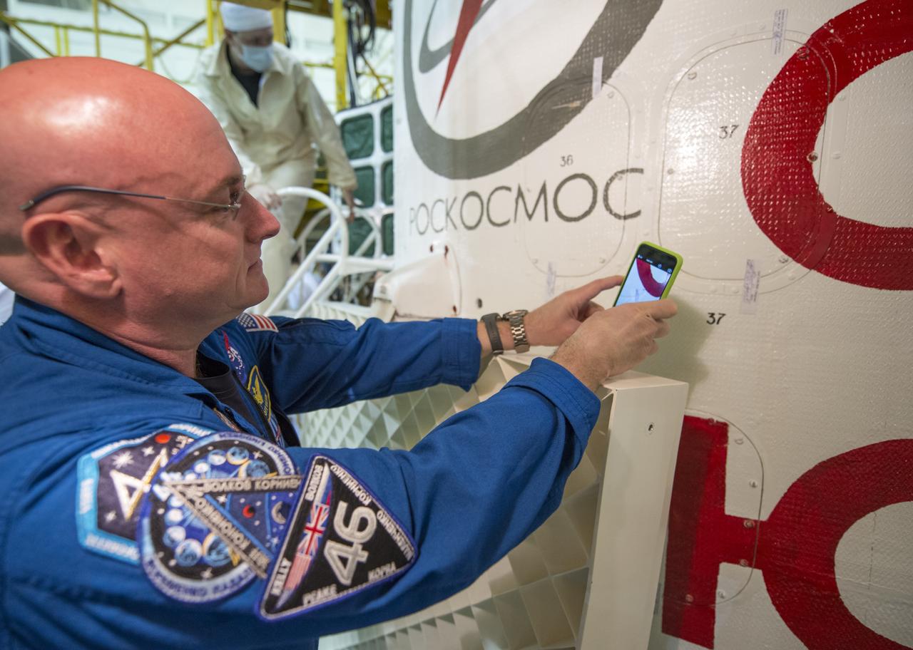 Expedition 43 NASA Astronaut Scott Kelly makes a photo of the Soyuz TMA-16M spacecraft during the final check of the spacecraft with Russian Cosmonauts Mikhail Kornienko, and Gennady Padalka of the Russian Federal Space Agency (Roscosmos), Monday, March 23, 2015 at the Baikonur Cosmodrome in Kazakhstan. Kelly, Kornienko, and Padalka are scheduled to launch to the International Space Station in the Soyuz TMA-16M spacecraft from the Baikonur Cosmodrome in Kazakhstan March 28, Kazakh time (March 27 Eastern time.) As the one-year crew, Kelly and Kornienko will return to Earth on Soyuz TMA-18M in March 2016. Photo Credit: (NASA/Bill Ingalls)