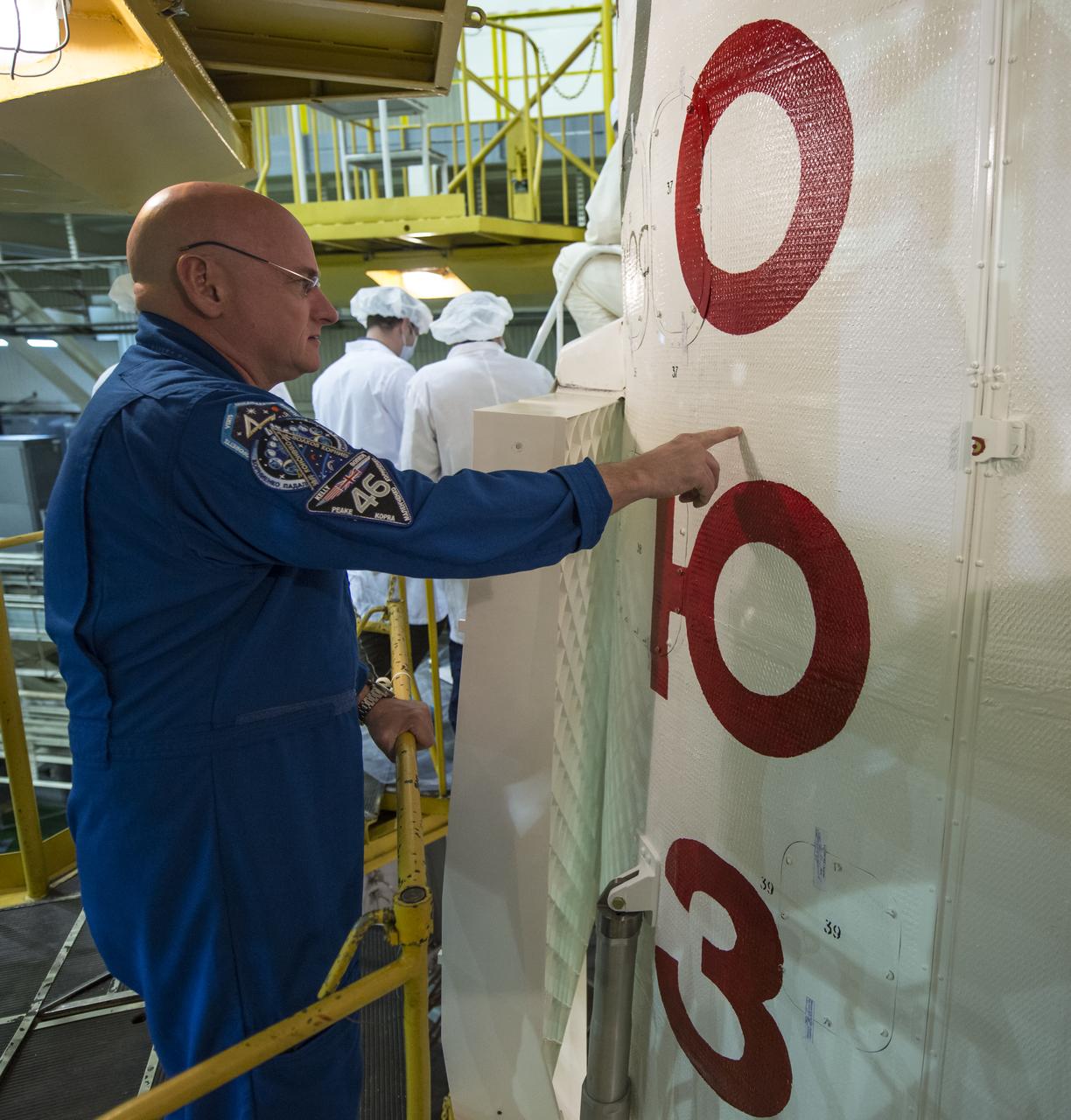 Expedition 43 NASA Astronaut Scott Kelly inspects the Soyuz TMA-16M spacecraft during the final check of the spacecraft with Russian Cosmonauts Mikhail Kornienko, and Gennady Padalka of the Russian Federal Space Agency (Roscosmos), Monday, March 23, 2015 at the Baikonur Cosmodrome in Kazakhstan. Kelly, Kornienko, and Padalka are scheduled to launch to the International Space Station in the Soyuz TMA-16M spacecraft from the Baikonur Cosmodrome in Kazakhstan March 28, Kazakh time (March 27 Eastern time.) As the one-year crew, Kelly and Kornienko will return to Earth on Soyuz TMA-18M in March 2016. Photo Credit: (NASA/Bill Ingalls)