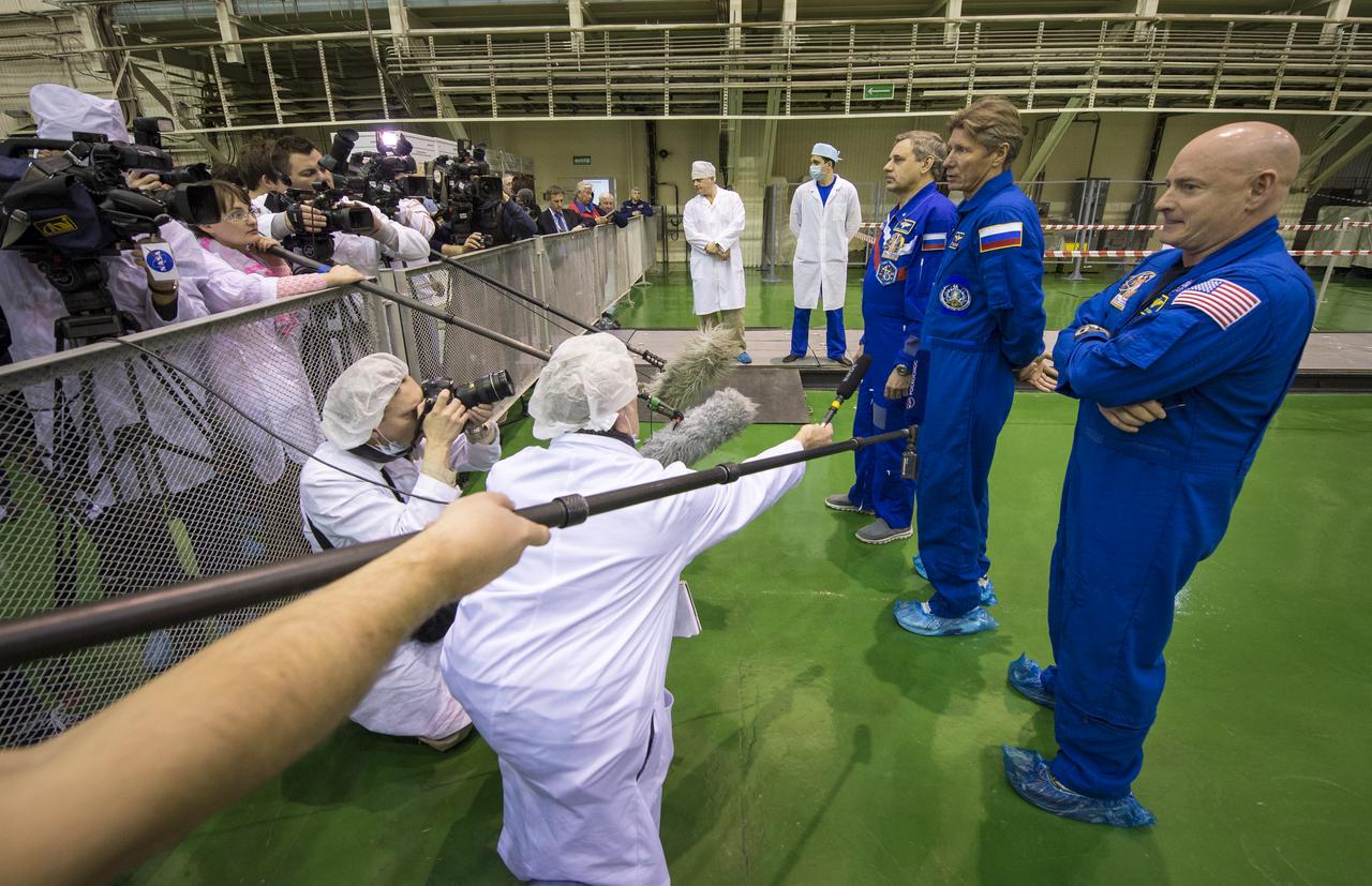 Expedition 43 Russian Cosmonauts Mikhail Kornienko, left, and Gennady Padalka, of the Russian Federal Space Agency (Roscosmos), and NASA Astronaut Scott Kelly answer reporters questions after having completed the Soyuz TMA-16M spacecraft final check, Monday, March 23, 2015 at the Baikonur Cosmodrome in Kazakhstan. Kelly, Kornienko, and Padalka are scheduled to launch to the International Space Station in the Soyuz TMA-16M spacecraft from the Baikonur Cosmodrome in Kazakhstan March 28, Kazakh time (March 27 Eastern time.) As the one-year crew, Kelly and Kornienko will return to Earth on Soyuz TMA-18M in March 2016. Photo Credit: (NASA/Bill Ingalls)