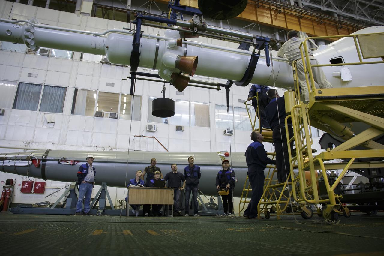 The Soyuz rocket and Soyuz TMA-16M spacecraft are assembled at Building 112 on the Baikonur Cosmodrome on Tuesday, March 24, 2015 in Baikonur, Kazakhstan. NASA Astronaut Scott Kelly, and Russian Cosmonauts Mikhail Kornienko, and Gennady Padalka of the Russian Federal Space Agency (Roscosmos) are scheduled to launch to the International Space Station in the Soyuz TMA-16M spacecraft from the Baikonur Cosmodrome in Kazakhstan March 28, Kazakh time (March 27 Eastern time.) As the one-year crew, Kelly and Kornienko will return to Earth on Soyuz TMA-18M in March 2016. Photo Credit: (NASA/Victor Zelentsov)