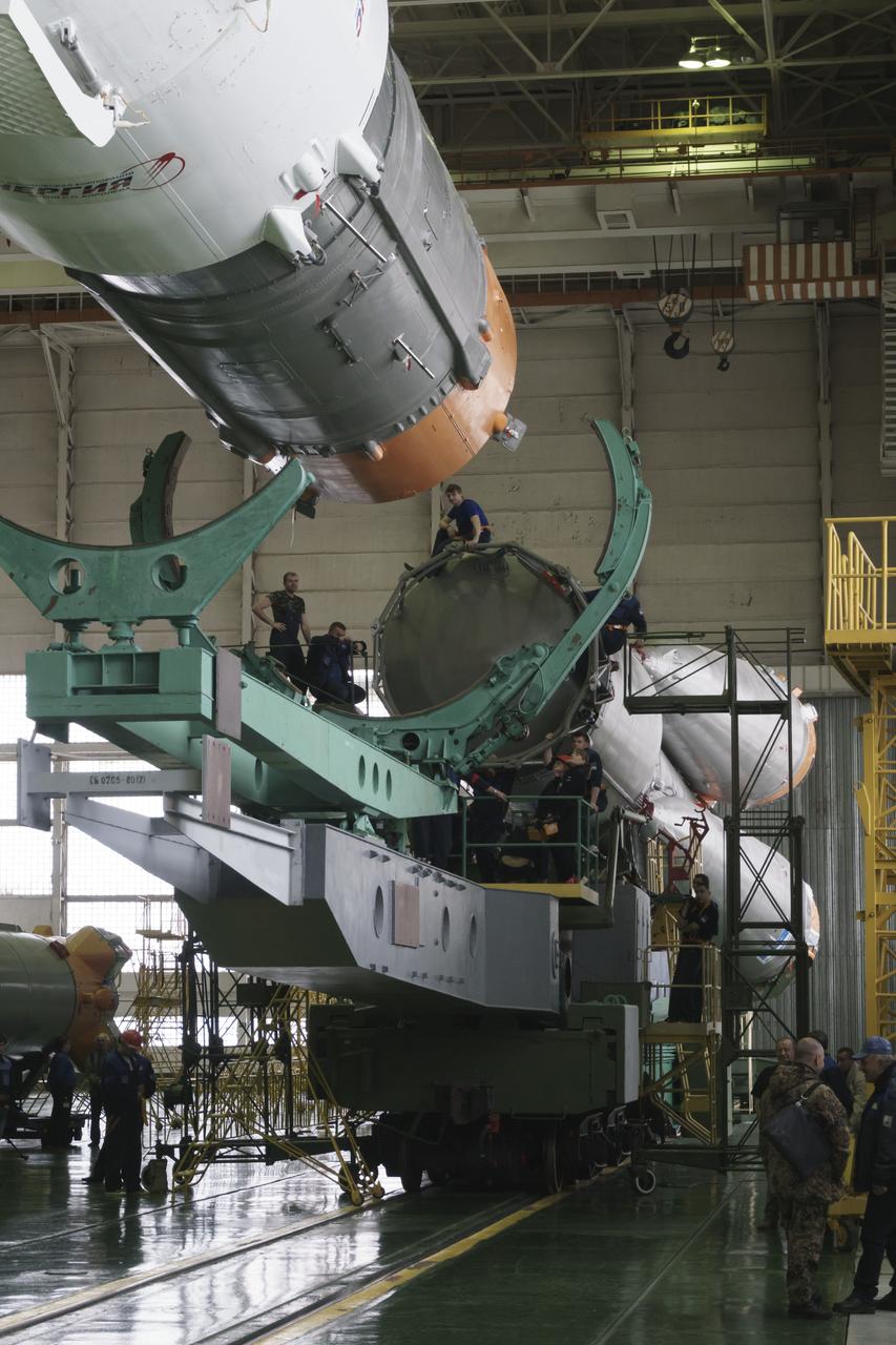 The Soyuz rocket and Soyuz TMA-16M spacecraft are assembled at Building 112 on the Baikonur Cosmodrome on Tuesday, March 24, 2015 in Baikonur, Kazakhstan. NASA Astronaut Scott Kelly, and Russian Cosmonauts Mikhail Kornienko, and Gennady Padalka of the Russian Federal Space Agency (Roscosmos) are scheduled to launch to the International Space Station in the Soyuz TMA-16M spacecraft from the Baikonur Cosmodrome in Kazakhstan March 28, Kazakh time (March 27 Eastern time.) As the one-year crew, Kelly and Kornienko will return to Earth on Soyuz TMA-18M in March 2016. Photo Credit: (NASA/Victor Zelentsov)