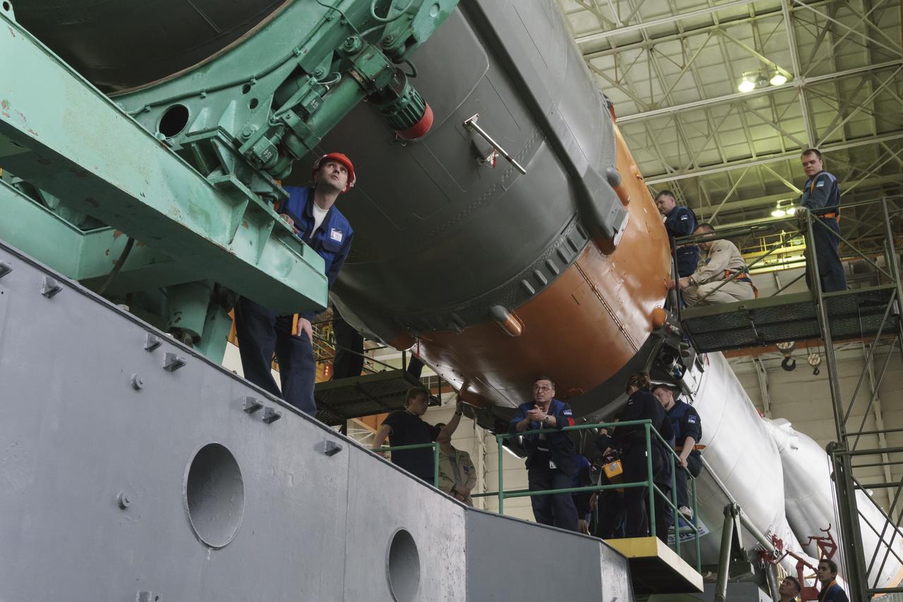 The Soyuz rocket and Soyuz TMA-16M spacecraft are assembled at Building 112 on the Baikonur Cosmodrome on Tuesday, March 24, 2015 in Baikonur, Kazakhstan. NASA Astronaut Scott Kelly, and Russian Cosmonauts Mikhail Kornienko, and Gennady Padalka of the Russian Federal Space Agency (Roscosmos) are scheduled to launch to the International Space Station in the Soyuz TMA-16M spacecraft from the Baikonur Cosmodrome in Kazakhstan March 28, Kazakh time (March 27 Eastern time.) As the one-year crew, Kelly and Kornienko will return to Earth on Soyuz TMA-18M in March 2016. Photo Credit: (NASA/Victor Zelentsov)