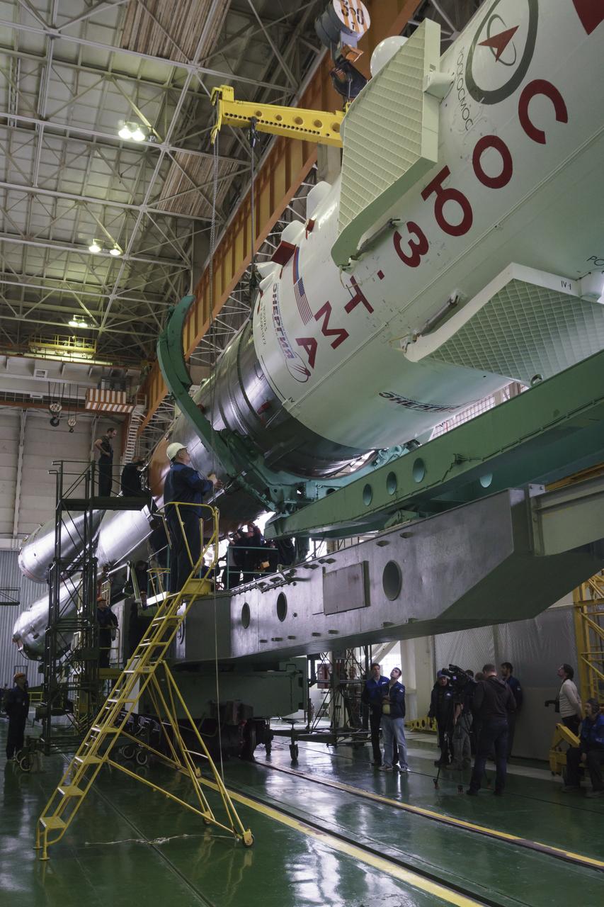 The Soyuz rocket and Soyuz TMA-16M spacecraft are assembled at Building 112 on the Baikonur Cosmodrome on Tuesday, March 24, 2015 in Baikonur, Kazakhstan. NASA Astronaut Scott Kelly, and Russian Cosmonauts Mikhail Kornienko, and Gennady Padalka of the Russian Federal Space Agency (Roscosmos) are scheduled to launch to the International Space Station in the Soyuz TMA-16M spacecraft from the Baikonur Cosmodrome in Kazakhstan March 28, Kazakh time (March 27 Eastern time.) As the one-year crew, Kelly and Kornienko will return to Earth on Soyuz TMA-18M in March 2016. Photo Credit: (NASA/Victor Zelentsov)