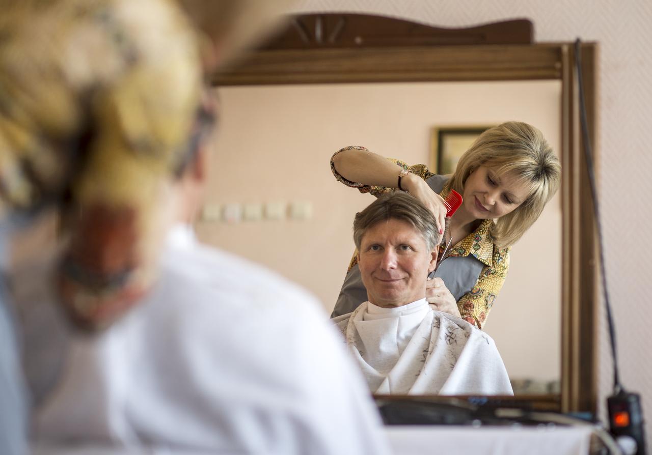 Expedition 43 Russian Cosmonaut Gennady Padalka of the Russian Federal Space Agency (Roscosmos) gets his hair cut at the Cosmonaut Hotel, on Wednesday, March 25, 2015, at the Baikonur Cosmodrome in Kazakhstan. Gennady Padalka, NASA Astronaut Scott Kelly, and Russian Cosmonaut Mikhail Kornienko are scheduled to launch to the International Space Station in the Soyuz TMA-16M spacecraft from the Baikonur Cosmodrome in Kazakhstan March 28, Kazakh time (March 27 Eastern time.) As the one-year crew, Kelly and Kornienko will return to Earth on Soyuz TMA-18M in March 2016. Photo Credit: (NASA/Bill Ingalls)