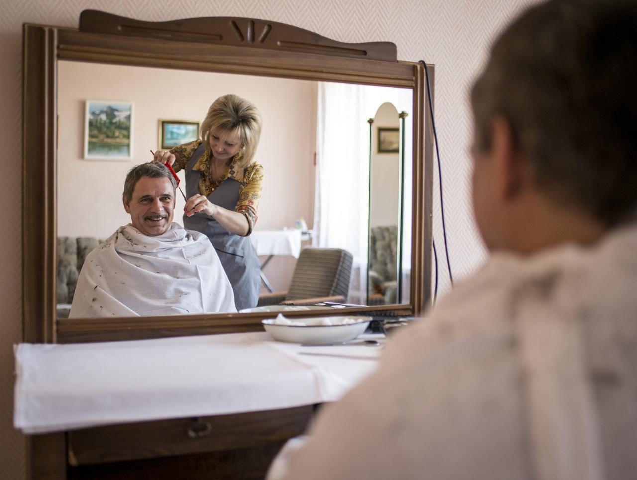 Expedition 43 Russian Cosmonaut Mikhail Kornienko of the Russian Federal Space Agency (Roscosmos) gets his hair cut at the Cosmonaut Hotel, on Wednesday, March 25, 2015, at the Baikonur Cosmodrome in Kazakhstan. Kornienko, NASA Astronaut Scott Kelly, and Russian Cosmonaut Gennady Padalka are scheduled to launch to the International Space Station in the Soyuz TMA-16M spacecraft from the Baikonur Cosmodrome in Kazakhstan March 28, Kazakh time (March 27 Eastern time.) As the one-year crew, Kelly and Kornienko will return to Earth on Soyuz TMA-18M in March 2016. Photo Credit: (NASA/Bill Ingalls)