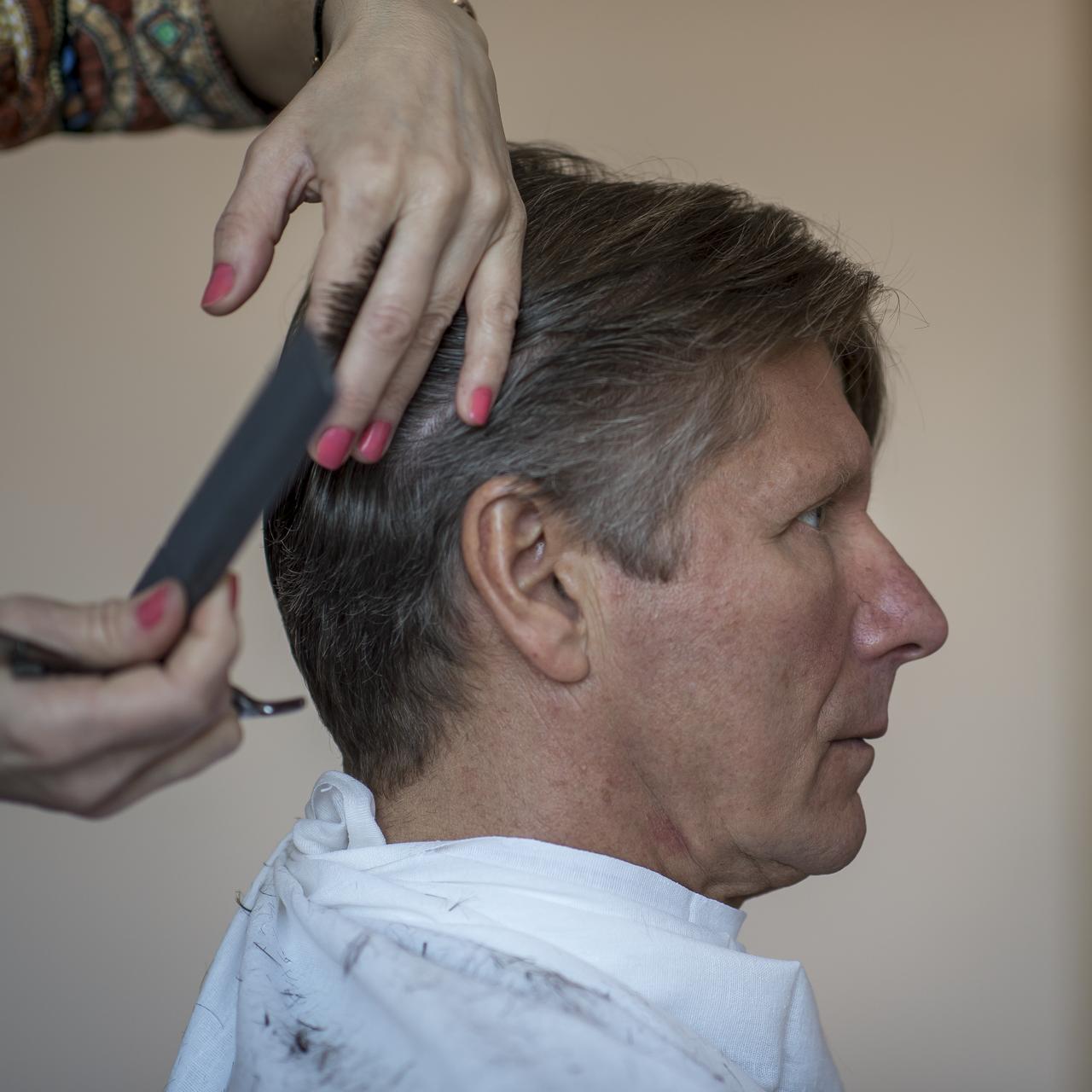 Expedition 43 Russian Cosmonaut Gennady Padalka of the Russian Federal Space Agency (Roscosmos) gets his hair cut at the Cosmonaut Hotel, on Wednesday, March 25, 2015, at the Baikonur Cosmodrome in Kazakhstan. Gennady Padalka, NASA Astronaut Scott Kelly, and Russian Cosmonaut Mikhail Kornienko are scheduled to launch to the International Space Station in the Soyuz TMA-16M spacecraft from the Baikonur Cosmodrome in Kazakhstan March 28, Kazakh time (March 27 Eastern time.) As the one-year crew, Kelly and Kornienko will return to Earth on Soyuz TMA-18M in March 2016. Photo Credit: (NASA/Bill Ingalls)