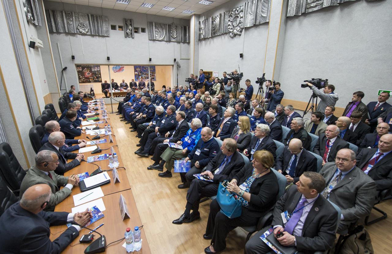 Expedition 43 prime and backup crews are seen in quarantine behind glass, from left, Expedition 43 prime crew members; NASA Astronaut Scott Kelly, Russian cosmonauts Gennady Padalka, and Mikhail Kornienko of Roscosmos, Expedition 43 backup crew members; NASA Astronaut Jeff Williams, Russian cosmonauts Alexei Ovchinin, and Sergei Volkov of Roscosmos during the State Commission meeting to approve the Soyuz launch to the International Space Station, Thursday, March 26, 2015, at the Cosmonaut Hotel in Baikonur, Kazakhstan. Kelly, Kornienko, and Padalka launched to the International Space Station in the Soyuz TMA-16M spacecraft from the Baikonur Cosmodrome in Kazakhstan March 28, Kazakh time (March 27 Eastern time.) As the one-year crew, Kelly and Kornienko will return to Earth on Soyuz TMA-18M in March 2016. Photo Credit (NASA/Bill Ingalls)