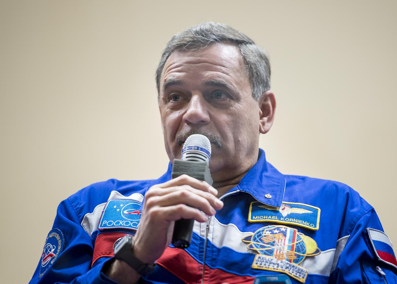 Expedition 43 Russian cosmonaut Mikhail Kornienko of the Russian Federal Space Agency (Roscosmos) answers reporter’s questions as he and, Russian cosmonaut Gennady Padalka of Roscosmos, and NASA Astronaut Scott Kelly participate in a crew press conference, Thursday, March 26, 2015, at the Cosmonaut Hotel in Baikonur, Kazakhstan. Kelly, Kornienko, and Padalka launched to the International Space Station in the Soyuz TMA-16M spacecraft from the Baikonur Cosmodrome in Kazakhstan March 28, Kazakh time (March 27 Eastern time.) As the one-year crew, Kelly and Kornienko will return to Earth on Soyuz TMA-18M in March 2016.  Photo Credit (NASA/Bill Ingalls)