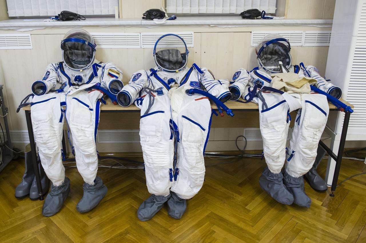 The Russian Sokol suits for Expedition 43 NASA Astronaut Scott Kelly, Russian Cosmonauts Gennady Padalka, and Mikhail Kornienko of the Russian Federal Space Agency (Roscosmos), are seen moments before they were donned by the trio for their launch onboard the Soyuz TMA-16M spacecraft to the International Space Station, Friday, March 27, 2015 in Baikonor, Kazakhstan. Kelly, Padalka, and Kornienko launched to the ISS from the Baikonur Cosmodrome in Kazakhstan March 28, Kazakh time (March 27 Eastern time.) As the one-year crew, Kelly and Kornienko will return to Earth on Soyuz TMA-18M in March 2016. Photo Credit: (NASA/GCTC/Andrey Shelepin)