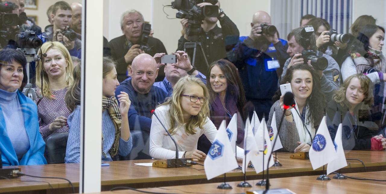 Family and friends of Expedition 43 NASA Astronaut Scott Kelly, Russian Cosmonauts Gennady Padalka, and Mikhail Kornienko of the Russian Federal Space Agency (Roscosmos) watch from behind glass as the crew has their Russian sokol suits pressure checked ahead of their launch onboard the Soyuz TMA-16M spacecraft to the International Space Station Friday, March 27, 2015 in Baikonor, Kazakhstan. Kelly, Padalka, and Kornienko launched to the ISS from the Baikonur Cosmodrome in Kazakhstan March 28, Kazakh time (March 27 Eastern time.) As the one-year crew, Kelly and Kornienko will return to Earth on Soyuz TMA-18M in March 2016.  Photo Credit: (NASA/GCTC/Andrey Shelepin)