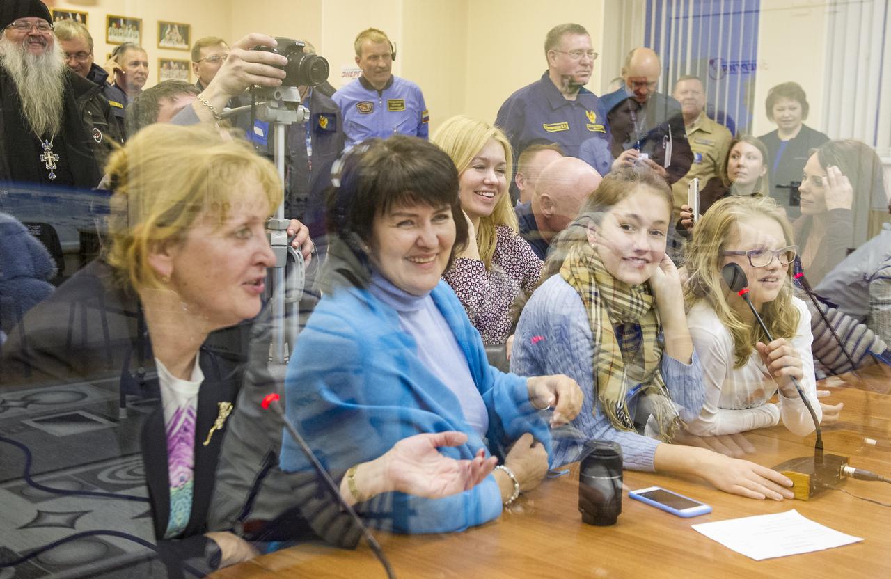Family and friends of Expedition 43 NASA Astronaut Scott Kelly, Russian Cosmonauts Gennady Padalka, and Mikhail Kornienko of the Russian Federal Space Agency (Roscosmos) watch from behind glass as the crew has their Russian sokol suits pressure checked ahead of their launch onboard the Soyuz TMA-16M spacecraft to the International Space Station Friday, March 27, 2015 in Baikonor, Kazakhstan. Kelly, Padalka, and Kornienko launched to the ISS from the Baikonur Cosmodrome in Kazakhstan March 28, Kazakh time (March 27 Eastern time.) As the one-year crew, Kelly and Kornienko will return to Earth on Soyuz TMA-18M in March 2016.  Photo Credit: (NASA/GCTC/Andrey Shelepin)