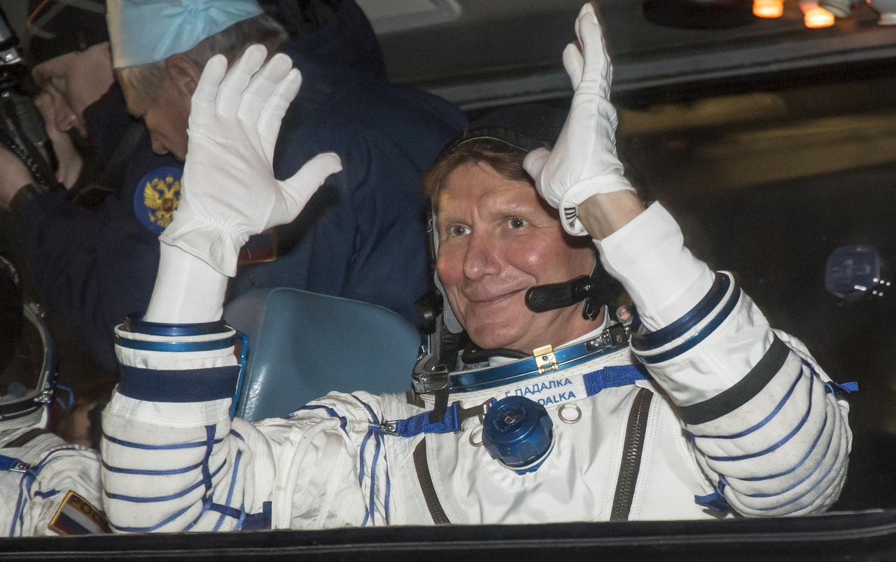 Expedition 43 Russian Cosmonaut Gennady Padalka of the Russian Federal Space Agency (Roscosmos) waves farewell to family and friends as he and fellow crew members NASA Astronaut Scott Kelly, and Russian Cosmonaut Mikhail Kornienko depart building 254 for their launch onboard the Soyuz TMA-16M spacecraft to the International Space Station Friday, March 27, 2015 in Baikonor, Kazakhstan. Kelly, Padalka, and Kornienko launched to the ISS from the Baikonur Cosmodrome in Kazakhstan March 28, Kazakh time (March 27 Eastern time.) As the one-year crew, Kelly and Kornienko will return to Earth on Soyuz TMA-18M in March 2016. Photo Credit: (NASA/Victor Zelentsov)