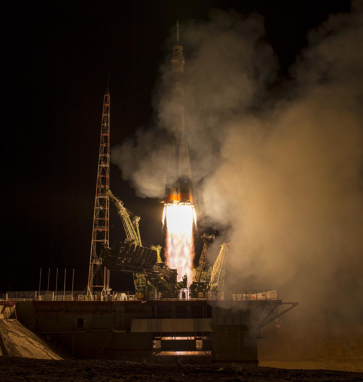 The Soyuz TMA-16M spacecraft is seen as it launches to the International Space Station with Expedition 43 NASA Astronaut Scott Kelly, Russian Cosmonauts Mikhail Kornienko, and Gennady Padalka of the Russian Federal Space Agency (Roscosmos) onboard Saturday, March 28, 2015, Kazakh time (March 27 Eastern time) from the Baikonur Cosmodrome in Kazakhstan. As the one-year crew, Kelly and Kornienko will return to Earth on Soyuz TMA-18M in March 2016. Photo Credit (NASA/Bill Ingalls)