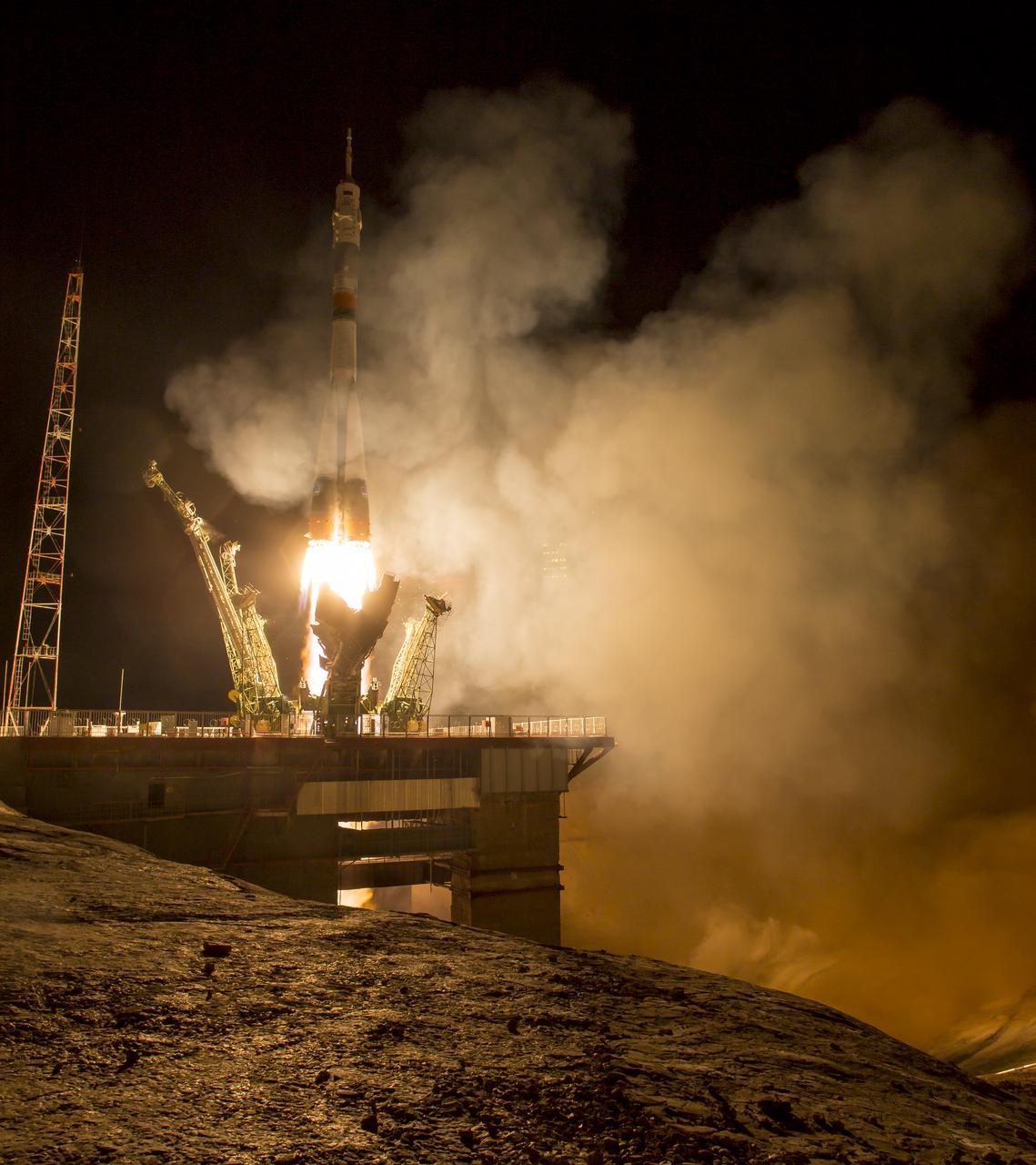 The Soyuz TMA-16M spacecraft is seen as it launches to the International Space Station with Expedition 43 NASA Astronaut Scott Kelly, Russian Cosmonauts Mikhail Kornienko, and Gennady Padalka of the Russian Federal Space Agency (Roscosmos) onboard Saturday, March 28, 2015, Kazakh time (March 27 Eastern time) from the Baikonur Cosmodrome in Kazakhstan. As the one-year crew, Kelly and Kornienko will return to Earth on Soyuz TMA-18M in March 2016. Photo Credit (NASA/Bill Ingalls)