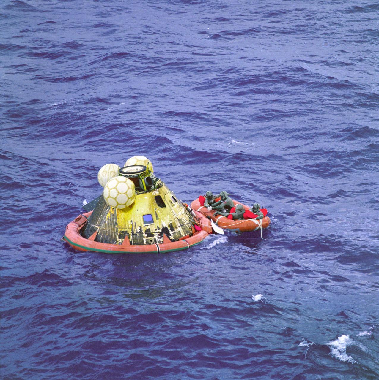 The Apollo 11 command module Columbia with astronauts Neil Armstrong, Michael Collins, and Buzz Aldrin aboard splashed down at 11:49 a.m. CDT, July 24, 1969, about 812 nautical miles southwest of Hawaii and only 12 nautical miles from the USS Hornet.