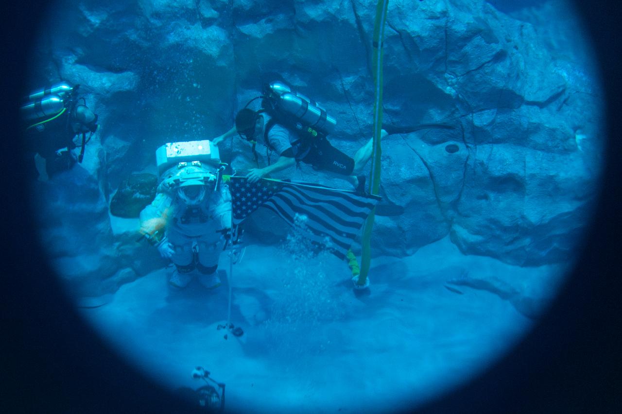 Axiom Space's AxEMU (Axiom Extravehicular Mobility Unit) spacesuit underwater during testing of its pressure garment system at NASA Johnson's Neutral Buoyancy Laboratory. Image Credit: Axiom Space