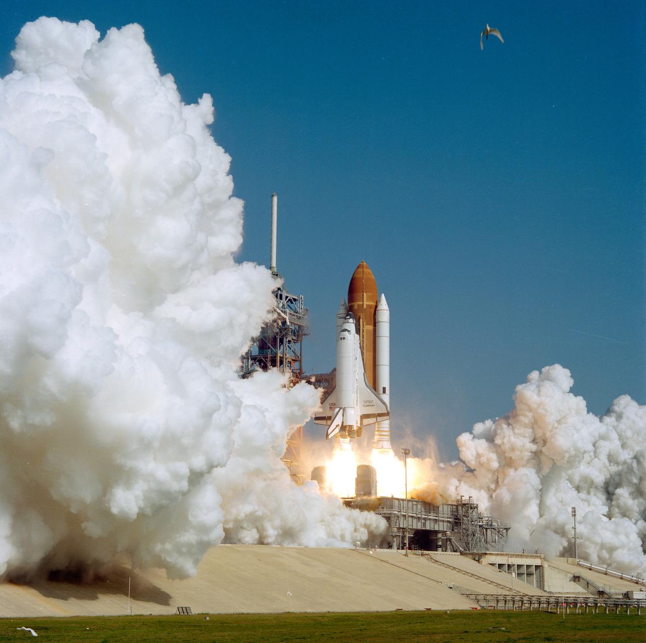 41C-3056 (6 April 1984) --- The Space Shuttle Challenger and its five-member astronaut crew leave the launch pad at the Kennedy Space Center (KSC) to begin a six-day stay in space. The launch occurred at 8:58:00:03 a.m. (EST), April 6, 1984. This photo was made with a 120 camera.