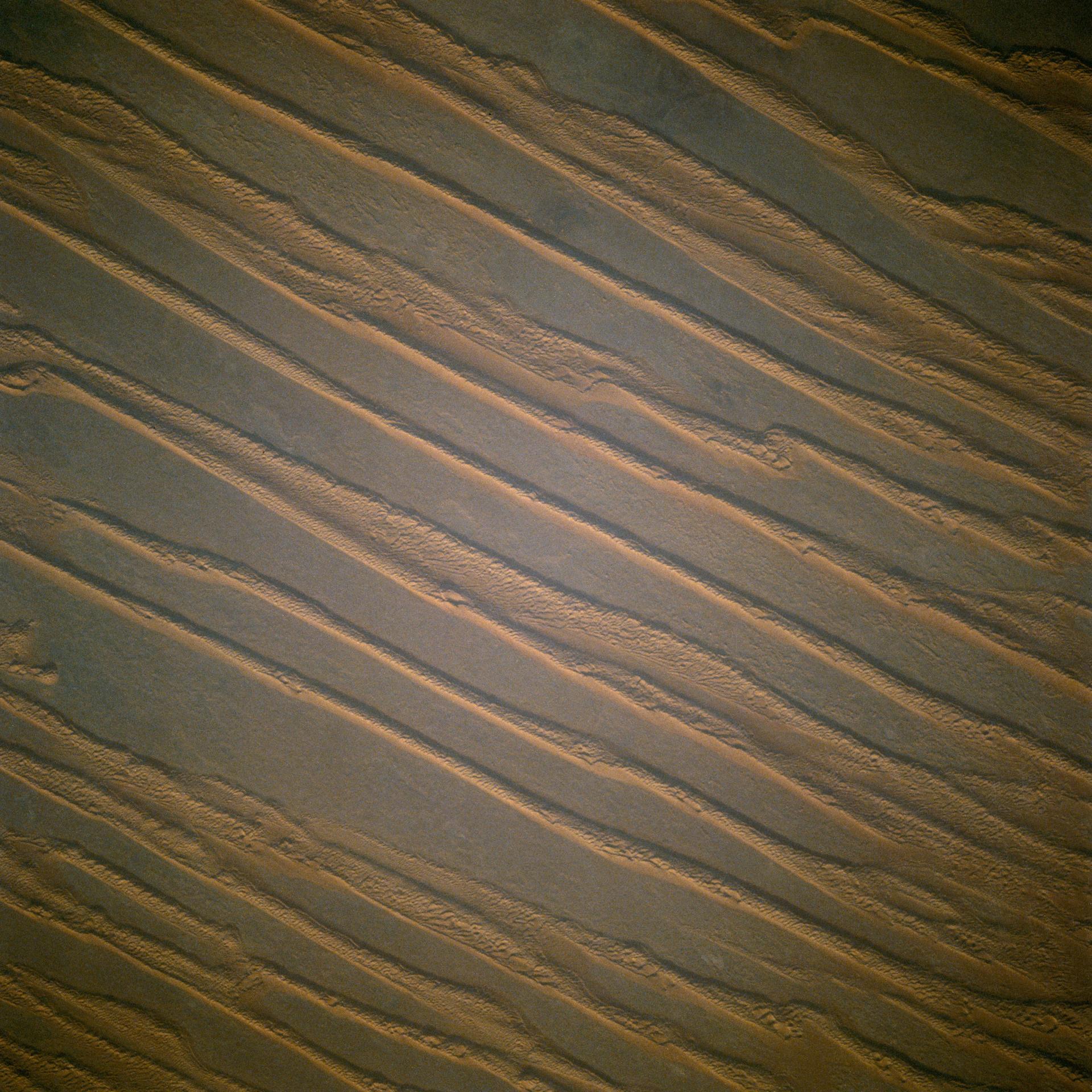 View from space of linear parallel sand dunes in Algeria