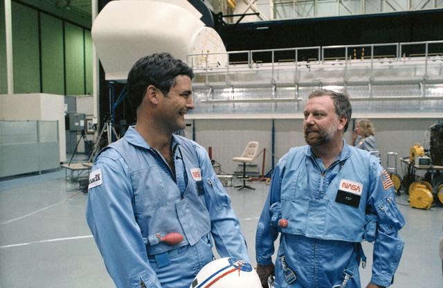 Payload specialists Garneau and Scully-Power discuss training