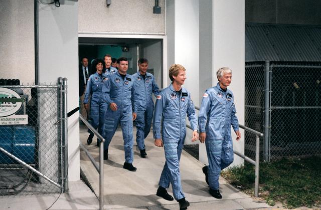 NASA image: 41-D crew leaves operations and checkout building at KSC