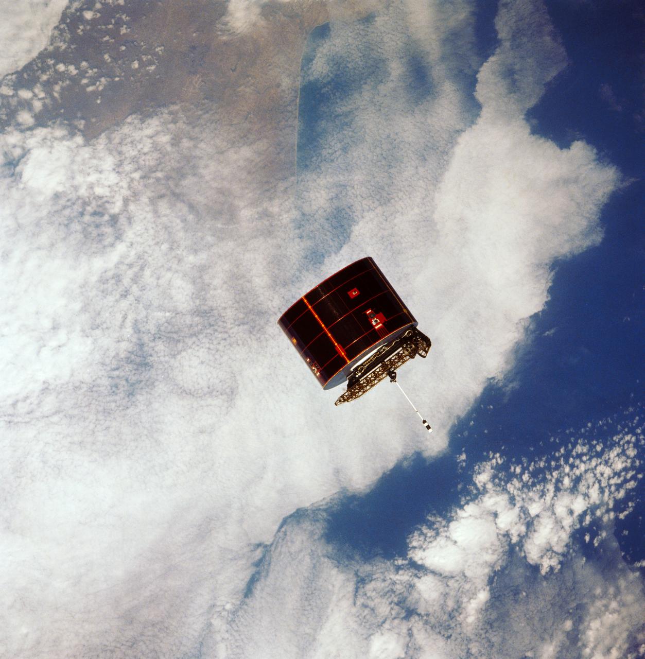 41D-32-067 (31 Aug 1984) --- The Atlantic Oceans coastline of Angola forms the backdrop for this scene of the Syncom IV (Leasat-2) spacecraft as it and the Space Shuttle Discovery begin their relative separation on Day Two of a busy-six-day 41-D mission. Moments, earlier in a Frisbee-like fashion, the spacecraft departed the Discovery’s cargo bay, marking the second of three scheduled satellite placements for the spacecraft’s maiden voyage. The scene was photographed with a 70mm camera aimed through the aft windows on the flight deck.
