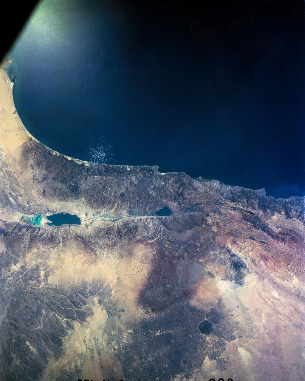 41G-120-056 (October 1984) --- Parts of Israel, Lebanon, Palestine, Syria and Jordan and part of the Mediterranean Sea are seen in this nearly-vertical, large format camera's view from the Earth-orbiting Space Shuttle Challenger.  The Sea of Galilee is at center frame and the Dead Sea at bottom center.  The frame's center coordinates are 32.5 degrees north latitude and 35.5 degrees east longitude.  A Linhof camera, using 4" x 5" film, was used to expose the frame through one of the windows on Challenger's aft flight deck.
