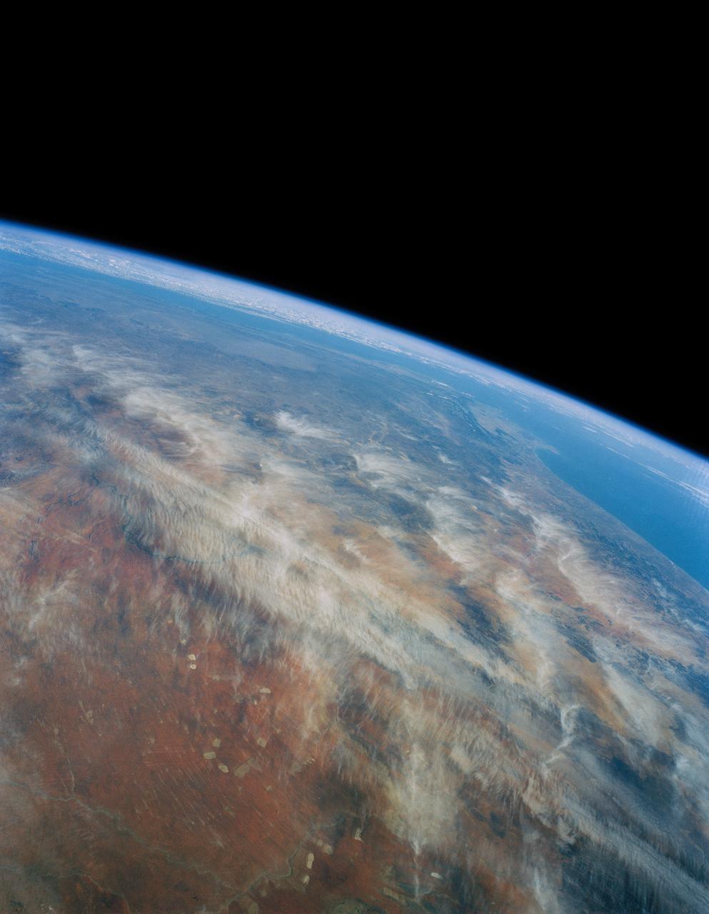 41G-121-189 (5-13 Oct 1984) --- The Kalihari Desert is visible in the foreground of this photograph covering three African nations.  The desert is a classic red to orange-red, with small depressions and salt encrustation's which appear as lakes.  Visible are Cape Town, the Cape of Good Hope and Cape Agulhas.  The crew consisted of astronauts Robert L. Crippen, commander; Jon A. McBride, pilot; mission specialist's Kathryn D. Sullivan, Sally K. Ride, and David D. Leestma; Canadian astronaut Marc Garneau; and Paul D. Scully-Power, payload specialist.        EDITOR'S NOTE: The STS-41G mission had the first American female EVA (Sullivan); first seven-person crew; first orbital fuel transfer; and the first Canadian (Garneau).