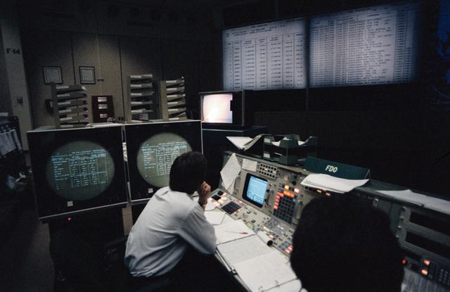 NASA image: View of the Flight Dynamics Officer (FDO) console in Mission Control