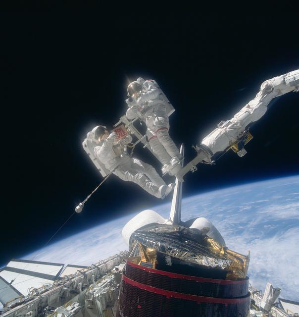 NASA image: Astronauts Gardner and Allen on the RMS after recapture of Westar VI