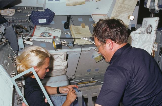NASA image: Astronauts Seddon and Bobko work on extension for RMS