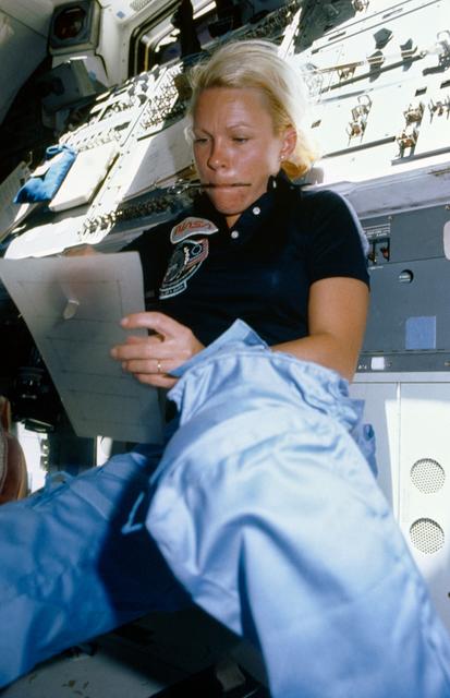 NASA image: Astronaut Rhea Seddon works on flyswatter-like snagging device