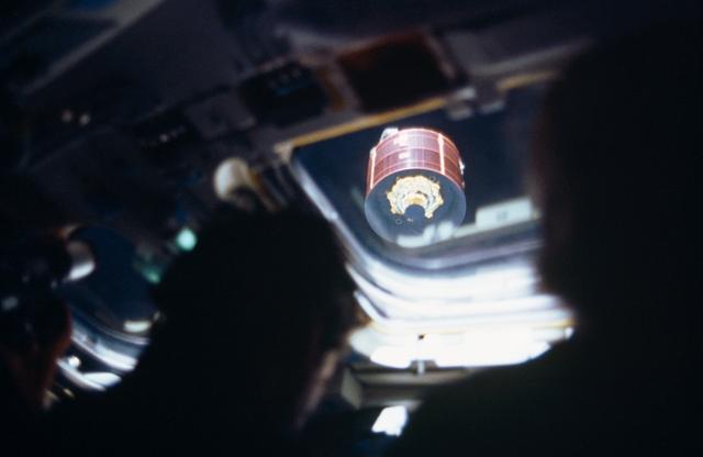 NASA image: View of the Syncom-IV (LEASAT) satellite from the flight deck window