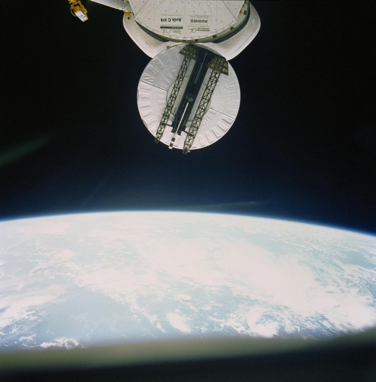 51D-31-081 (13 April 1985) --- 70mm view of the Syncom IV (LEASAT) communications satellite as it spins, frisbee fashion, from the cargo bay of the Earth orbiting Space Shuttle Discovery.