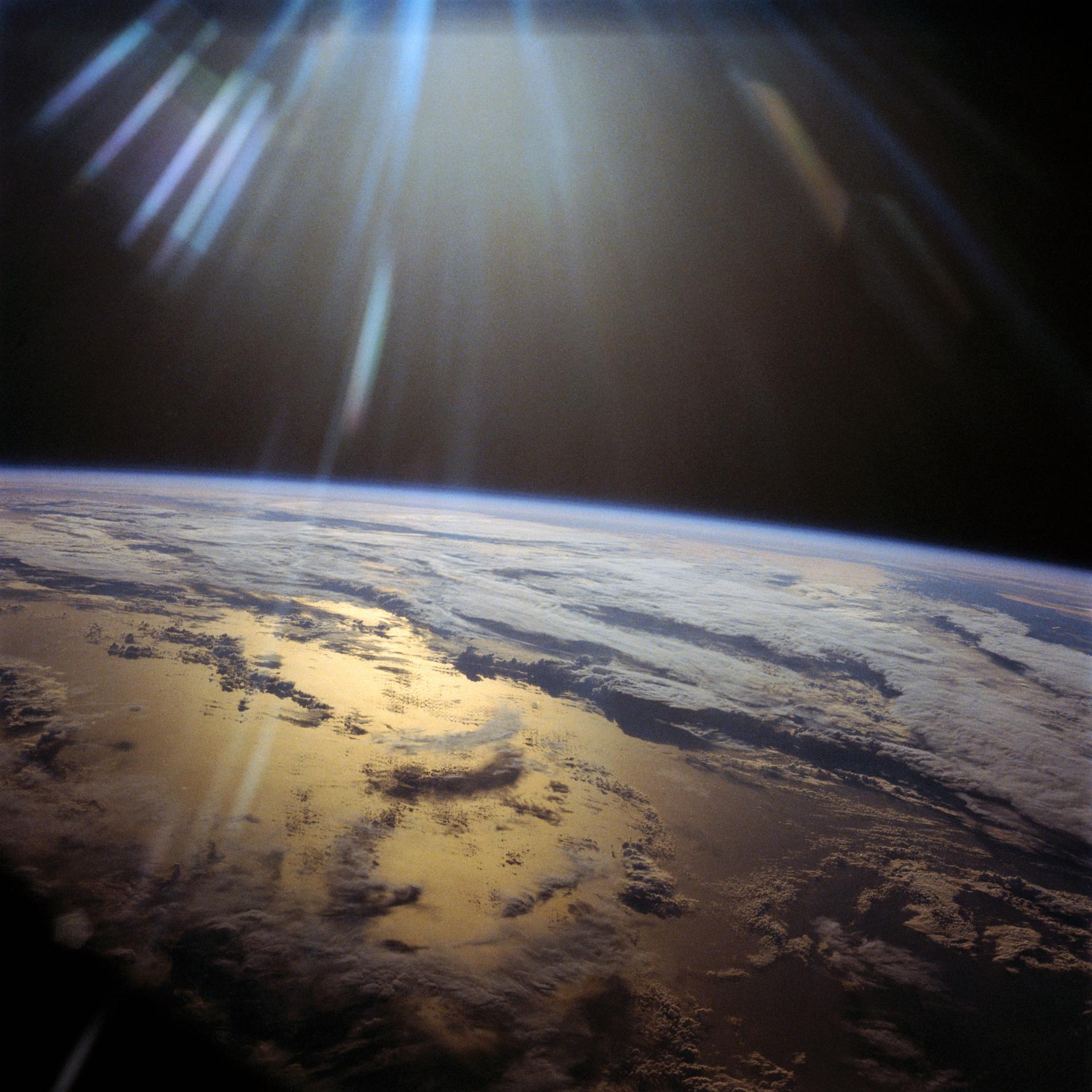 Sunlight reflects off the Indian Ocean in this view from orbit in late July 1985