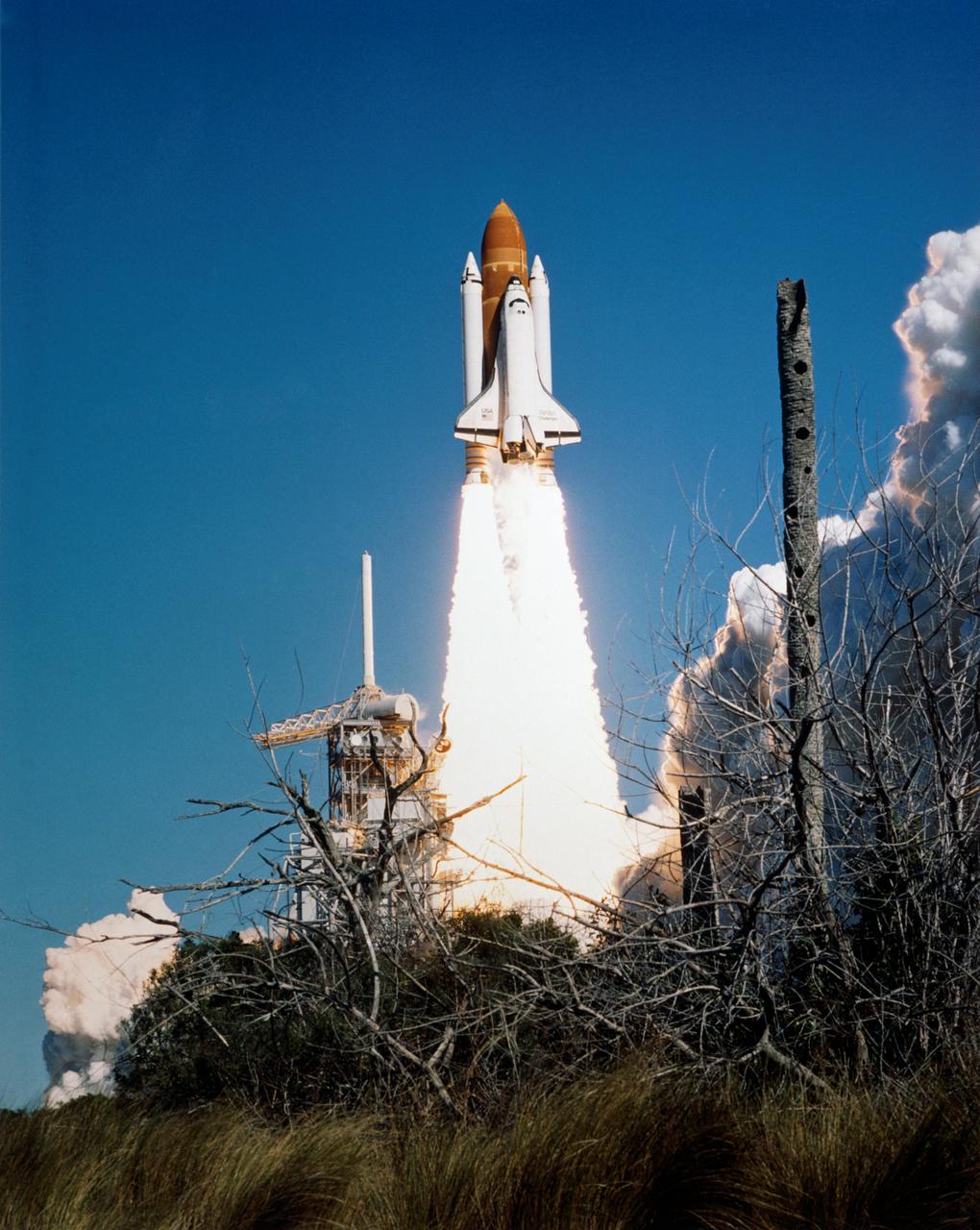 51L-S-154 (28 Jan. 1986) --- The space shuttle Challenger lifted off from Pad 39B Jan. 28, 1986 at 11:38 a.m. (EST) with a crew of seven astronauts and the Tracking and Data Relay Satellite (TDRS). An accident 73 seconds after liftoff claimed both crew and vehicle. Photo credit: NASA