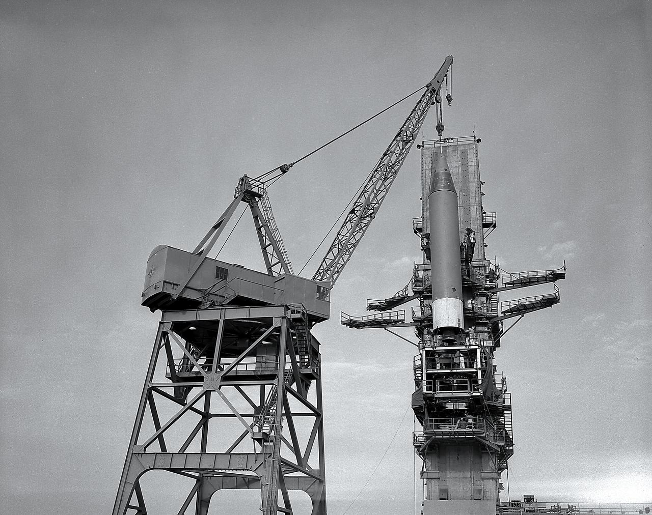 Installation of a Jupiter missile in ABMA (Army Ballistic Missile Agency) West Test Stand, Jan. 16, 1957. Jupiter was a 1500-mile range missile