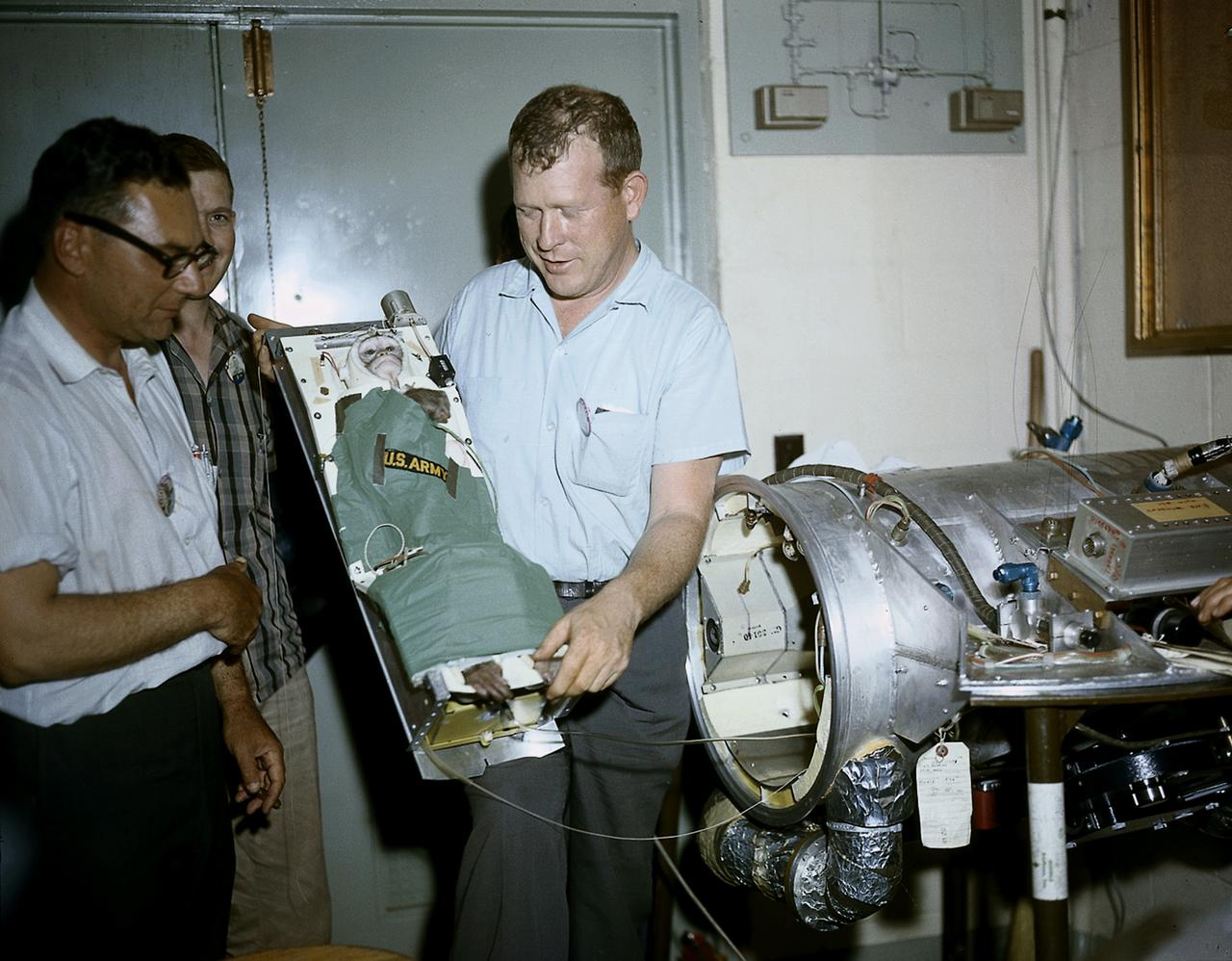 A squirrel monkey, Able, is being ready for placement into a capsule for a preflight test of Jupiter, AM-18 mission. AM-18 was launched on May 28, 1959 and also carried a rhesus monkey, Baker, into suborbit. 