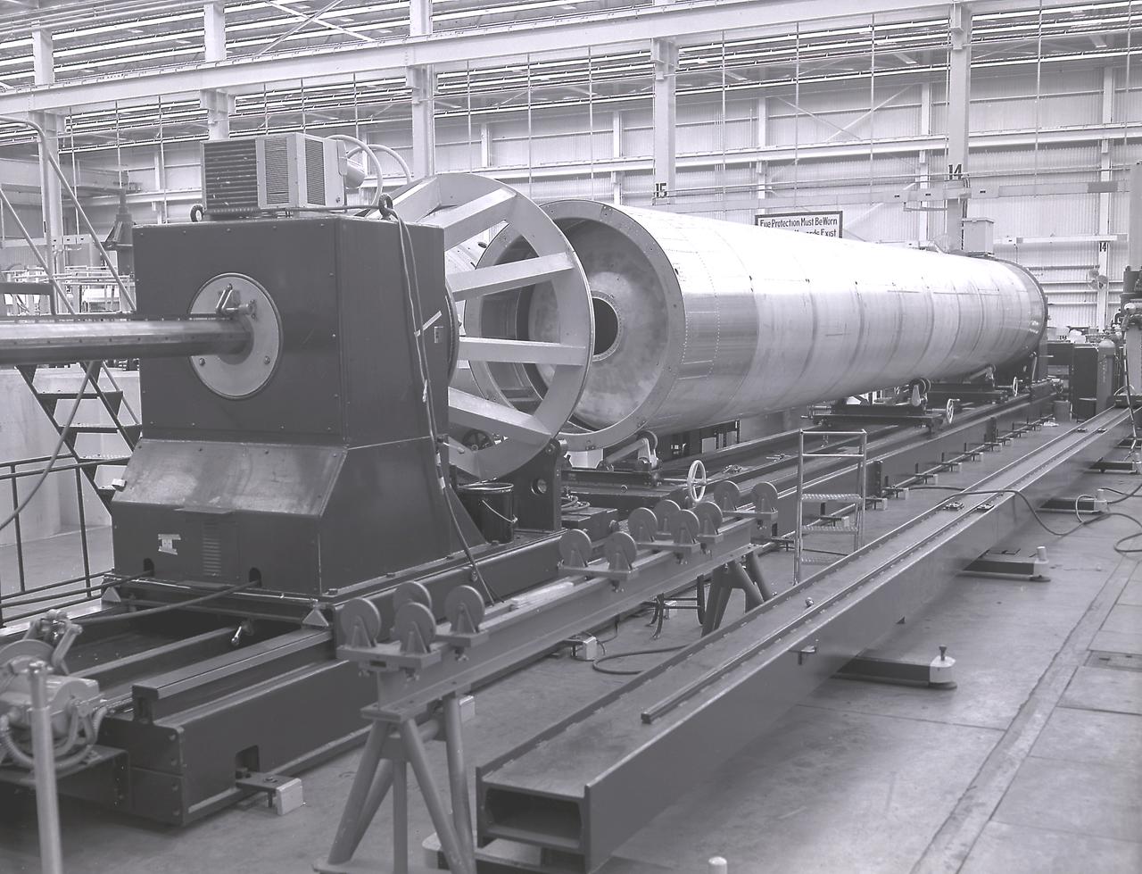 The first circumferential welding being applied on a Saturn fuel container in the Army Ballistic Missile Agency (ABMA) fabrication laboratory, Building 4707, in May 1959.