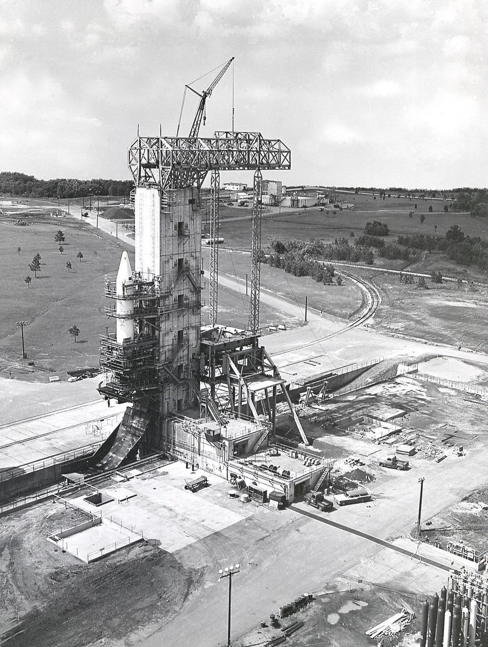 The Army Ballistic Missile Agency (ABMA) test tower being modified for testing the Saturn booster.